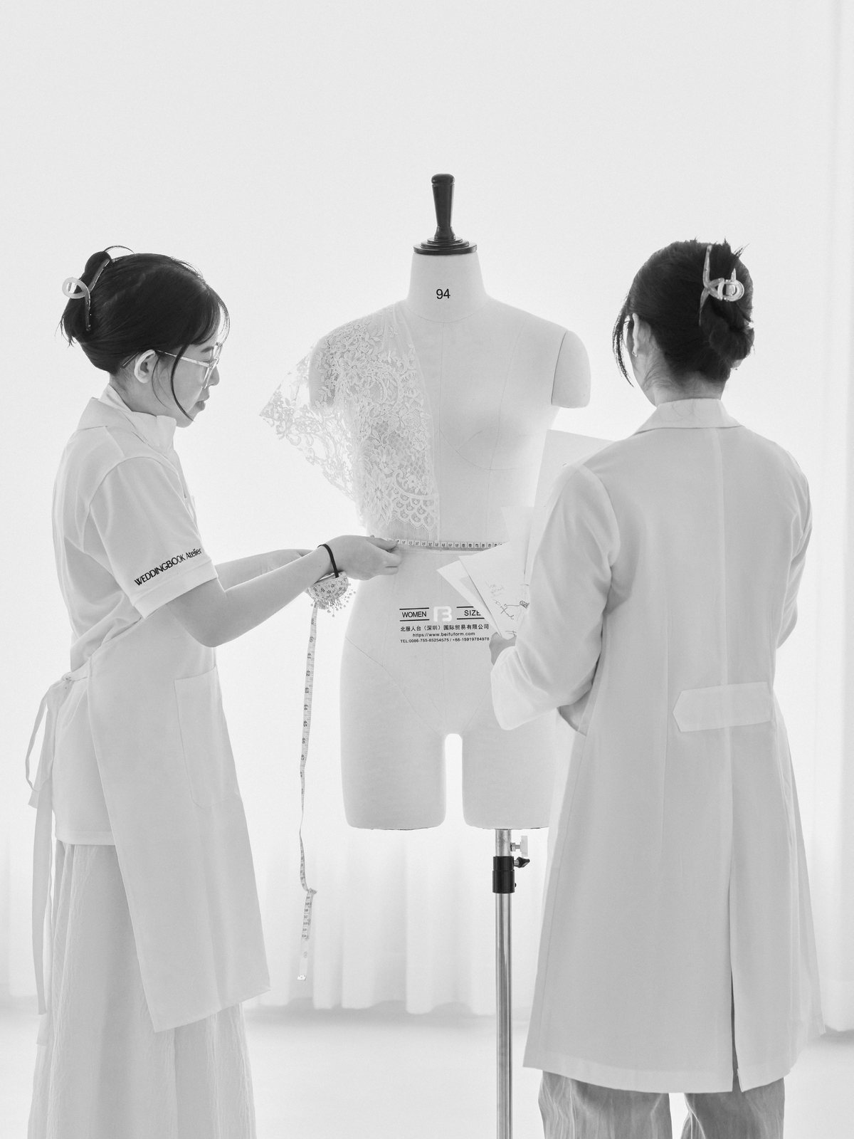 Staff in uniform during a fitting