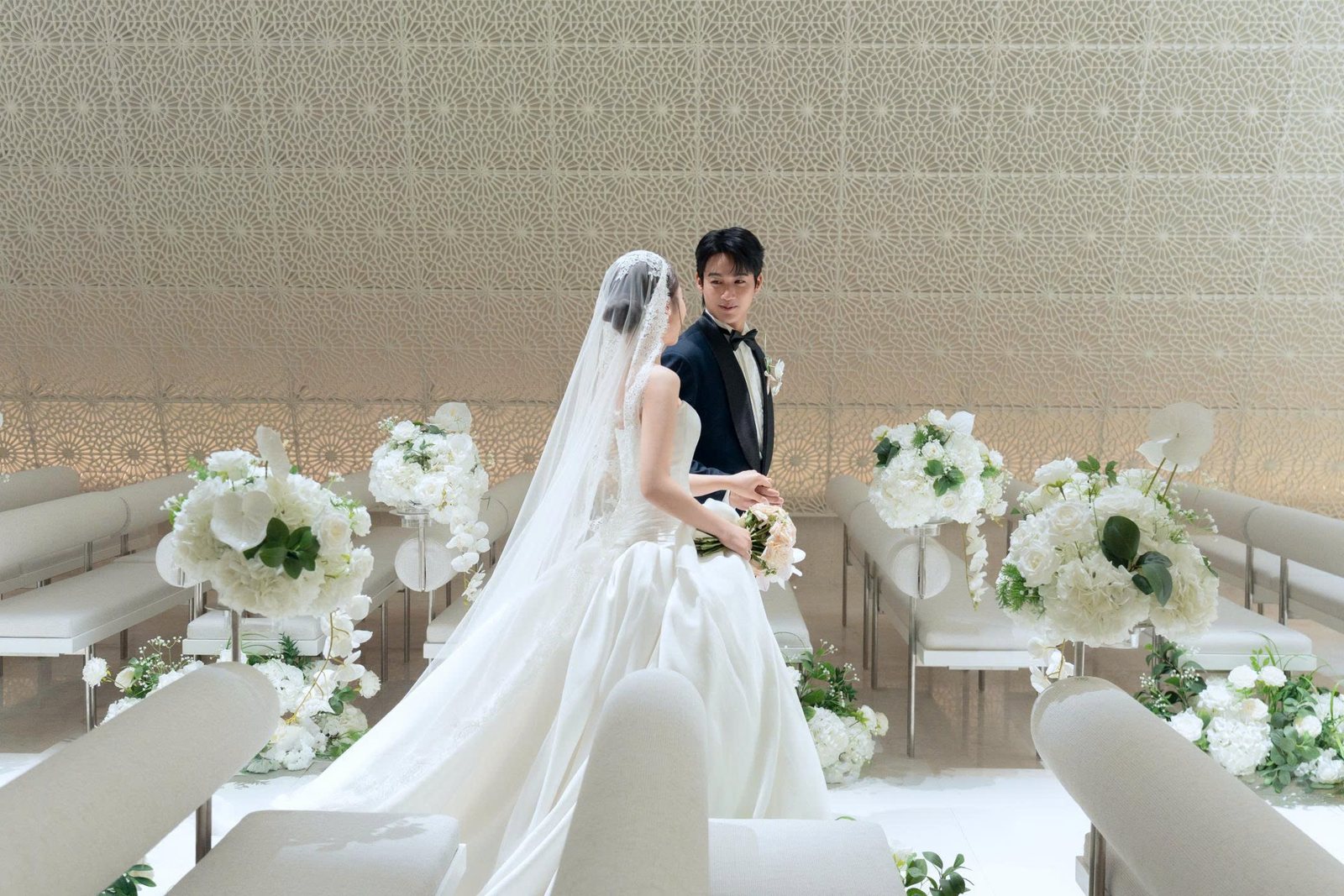 Bride and groom among the ceremony benches