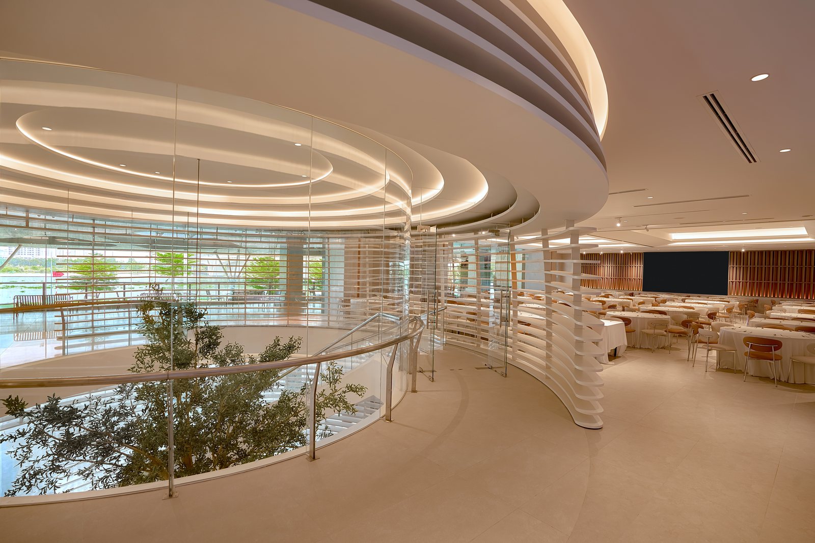 Second-floor hall with atrium and curved ceiling