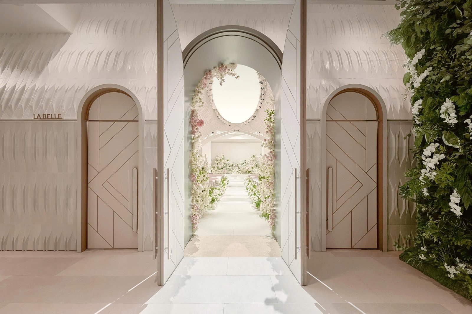 Arched doors opening onto the ceremony hall at The Chapel at Saigon